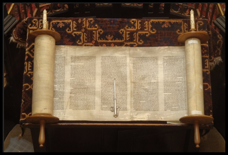 image open torah with pointer.